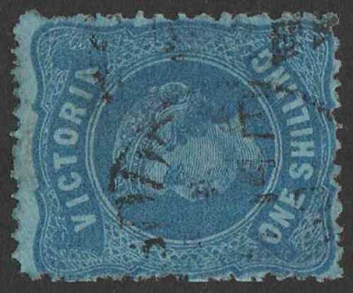 1873-87 QV 1/- indigo on blue, wmk V crown (w19) SIDEWAYS, rough perf 13
